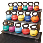 A rack displaying multiple kettlebells of various weights arranged neatly for easy access.